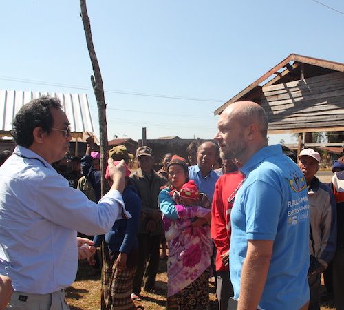 UN-Habitat Member speaking with teammates and community members/beneficiaries of AF1 project