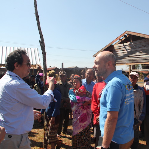 UN-Habitat Member speaking with teammates and community members/beneficiaries of AF1 project